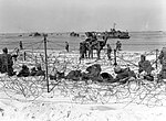 Thumbnail for File:German prisoners of war in a barbed-wire enclosure on Utah Beach.jpg