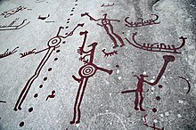Men with weapons. Rock Carvings in Tanum, western Sweden Hallristningar Tanum 1.1 yxbarare med cirkelkroppar.jpg