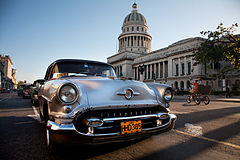 Vintage Oldsmobile in front of the Capitolio. Havana (La Habana), Cuba