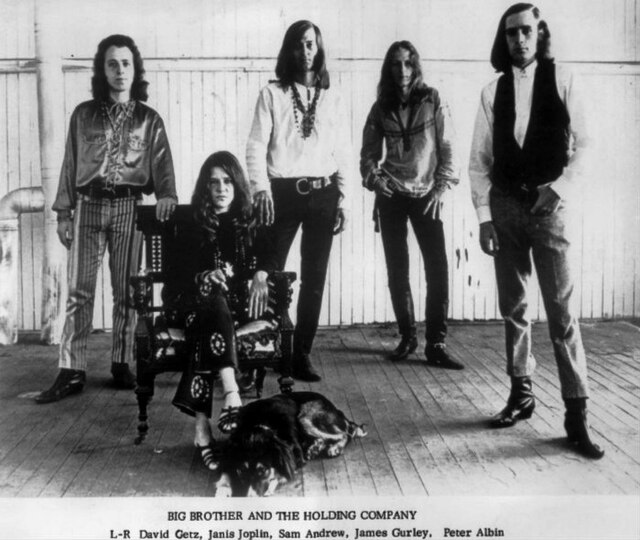 Joplin (seated) with Big Brother and the Holding Company, c. 1966–1967 photograph Bob Seidemann