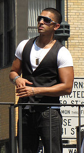 Jay Sean (pictured) co-wrote and appears as a featured artist on the single "What Happened to Us" for Get 'Em Girls (2010). Jay Sean - 2009 India Day Parade.jpg