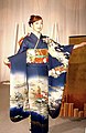 A woman wearing a kimono.