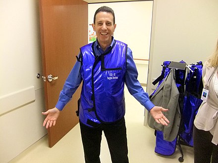 A rubber coated lead apron protects organs from exposure to x-rays. Lead Apron worn by Dr Danny Sands.jpg