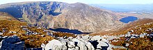 Mangerton Mountain (l), Lough Erhogh (c), and Mangerton North Top (r), seen from across the Horse's Glen from the summit of Stoompa Mangerton and Mangerton North Top.jpg