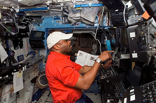 Leland Melvin working on the robotic control computers