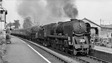 Rebuilt 34048 Crediton leading a double-headed Summer Saturday holiday express on the heavy gradients of the Somerset and Dorset Joint Railway in 1959