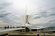 I. The movable Burke brise soleil on the Quadracci Pavilion of the Milwaukee Art Museum closes at sunset