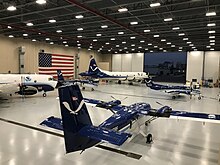 NOAA's two Lockheed WP-3D Orion aircraft along with a De Havilland Canada DHC-6 Twin Otter (foreground) and a Beechcraft King Air inside the NOAA Aircraft Operations Center hangar in Lakeland, Florida. NOAA Aircraft Operations Center Hangar interior.jpg