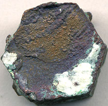 Native copper pseudomorph after aragonite, with red cuprite and green malachite alteration Native copper pseudomorph after aragonite, western Bolivia.jpg