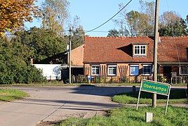 Place sign on the western edge of the village