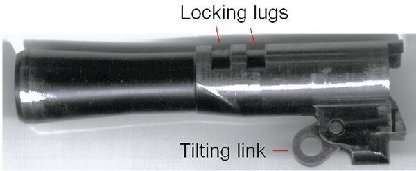 The barrel from a Para Ordnance P12.45, an M1911-derived design which uses short recoil operation. Under recoil, the barrel moves back in the frame, r