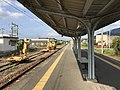 A view of the platform and tracks, looking east, in the direction of Meinohama. Note the siding.