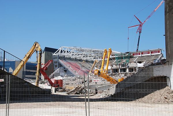 Old stadium demolished with new stadium rising behind, June 2013