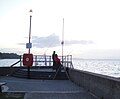 Fishermen at the Esplanade in Ryde, Isle of Wight seen late in the evening.