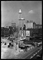 1929: Construction of upper floors (background at right)