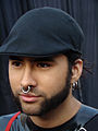 Man with septum piercing and ear lobes piercings