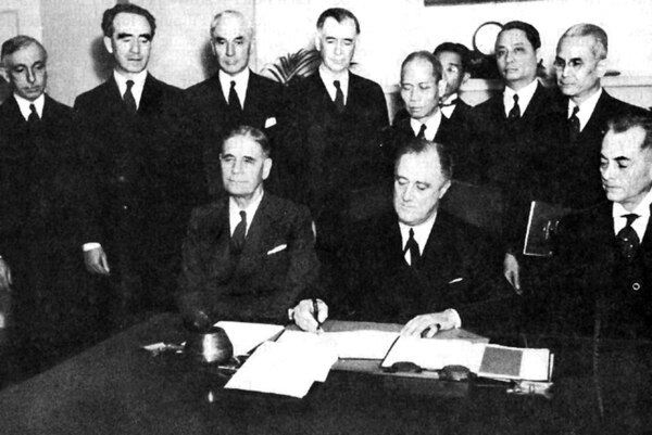 March 23, 1935: Constitutional Convention. Seated, left to right: George H. Dern, President Franklin D. Roosevelt, and Manuel L. Quezon