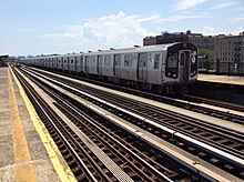 F train leaving on the southbound platform prior to renovation