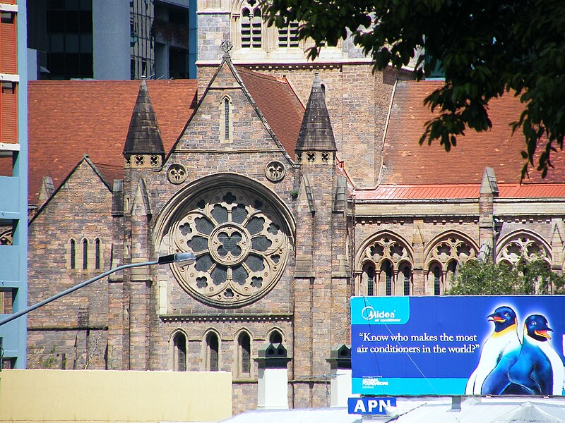 File:St John's Anglican Cathedral North Transept rose window and billboard from Centenery Place Fortitude Valley DSCF9641.jpg