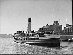 With her enclosed upper deck. Leaving Circular Quay, 1937.