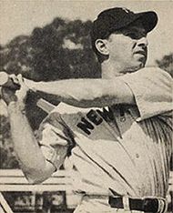 Tommy Henrich, Yankees' first sacker, is embraced by pitcher Allie