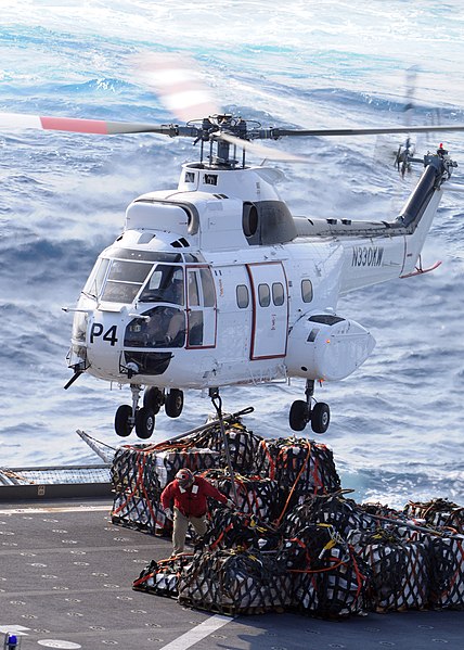 File:US Navy 090529-N-1062H-033 An SA-330 Puma helicopter retrieves cargo for transfer to the guided-missile cruiser USS Cowpens (CG 63).jpg