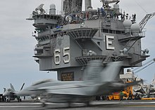 Island control structure of USS Enterprise US Navy 100512-N-8446A-004 An F-A-18F Super Hornet assigned to the Fighting Checkmates of Strike Fighter Squadron (VFA) 211 lands aboard the aircraft carrier USS Enterprise (CVN 65).jpg