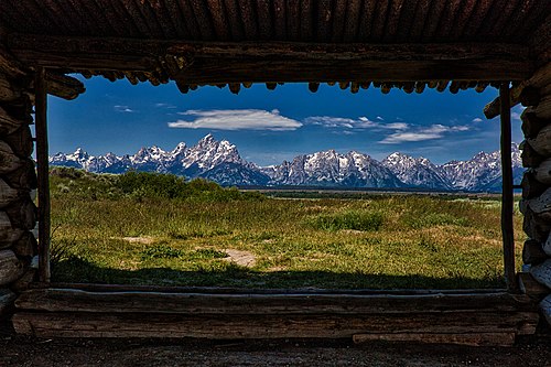 Looking through the Cunningham Cabin in Grand Teton National Park, by Abu Sufian Mohammad Asib.