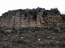 View of the walls from below Walls of Persqopi Castle as seen from below, taken 2018-03-27.jpg