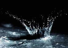 Soil and water being splashed by the impact of a single raindrop Water and soil splashed by the impact of a single raindrop.jpg