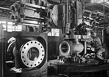 Worker machining hole flange, Cameron Iron Works, Houston, 1948 Worker machining hole flange, Cameron Iron Works, Houston, TX.jpg