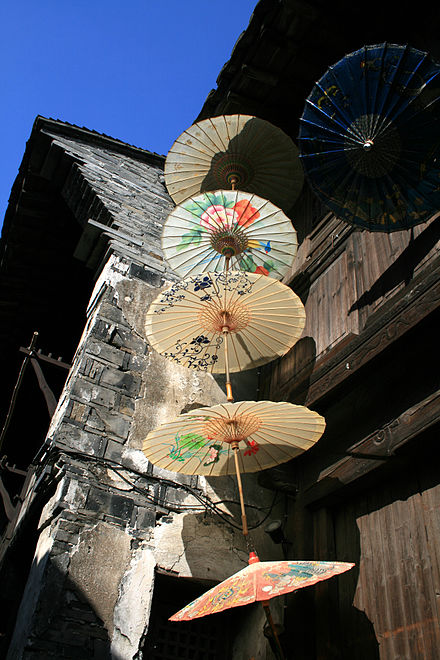 Paper umbrellas repurposed as sign in Wuzhen