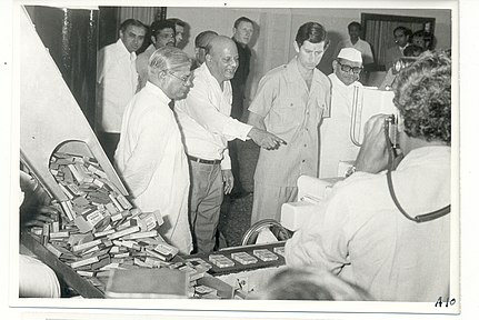 Madhav Singh Solanki, H. M. Dalaya, Prince Charles and Morarji Desai observe Amul's butter production (1980).