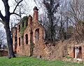 Castle ruins with remains of the powder tower and surrounding enclosure wall