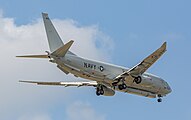 A Boeing P-8 Poseidon, tail number 168996, on final approach at Kadena Air Base in Okinawa, Japan. It has an AN/APS-154 Advanced Airborne Sensor (AAS) mounted underneath it.