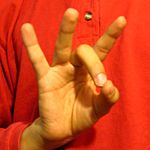 The "8" handshape produced with the the palm facing the camera