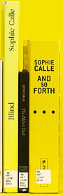 Three books with different titling orientations: ascending (left), descending (middle) and upright (right) A selection of Sophie Calle books spine titling.jpg