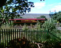 EWS 66101 waits to enter Aberthaw Power Station. The ash heaps are in the direct background