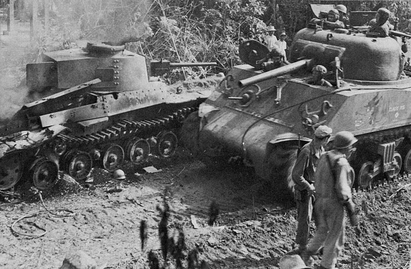 File:American Sherman tank after destroying a Japanese tank.jpg