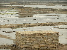 An aquaculture establishment in Anhai Bay, near Shijing Town. Note the use of the local stone for construction.