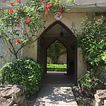 East entrance looking into the courtyard. Arch, The Abbey Sutton Courtenay.jpg