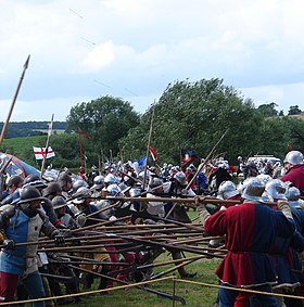 Arrows fly at a battle re-enactment at the Tewkesbury Medieval Festival in 2009 Battle of Tewkesbury reenactment - fighting while arrows fly.jpg