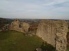 A ruin wall on a hilltop.