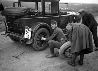 File:Car repair, tire, soldier, number 