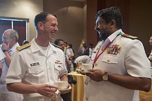John Richardson and Ravindra Wijegunaratne Chief of Naval Operations Adm. John Richardson talks with the Commander of the Sri Lankan Navy, Vice Adm. Ravindra Wijegunaratne, during the welcoming ceremonies of India's International Fleet Review (IFR) 2016.JPG