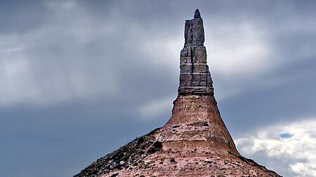 A thin pillar of rock juts upwards.