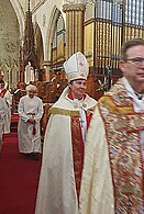 Newly consecrated Bishop Vanessa Bennett proceeds from the cathedral behind Dean Gavin Krebs