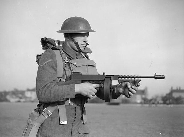 A soldier of the East Surrey Regiment, pictured here equipped with a Thompson m1928 submachine gun (drum magazine), 25 November 1940