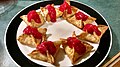 Crab Rangoon served with a raspberry topping