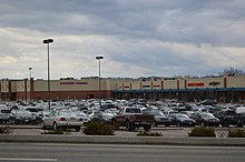 Parking minimums can contribute to a car-dominated built environment. Cranberry Mall parking lots and buildings.jpg